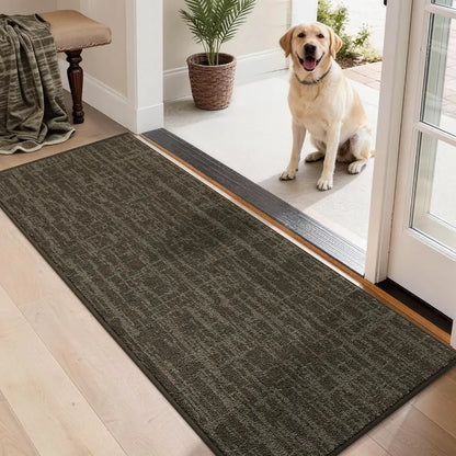 Dog standing on a doormat at the entrance of a home