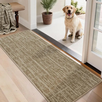 Dog standing on a doormat at the entrance of a home