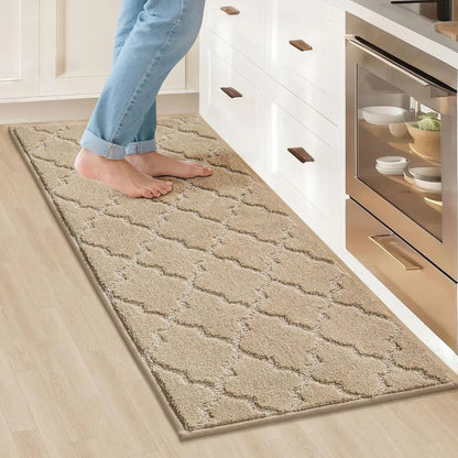 Beige patterned rug on a wooden floor in a kitchen setting