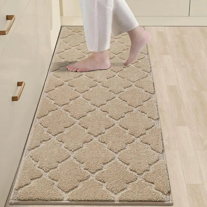 Beige diamond-patterned rug on a wooden floor with a person stepping onto it.
