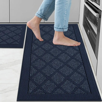 Person stepping onto a navy blue textured mat in a kitchen.