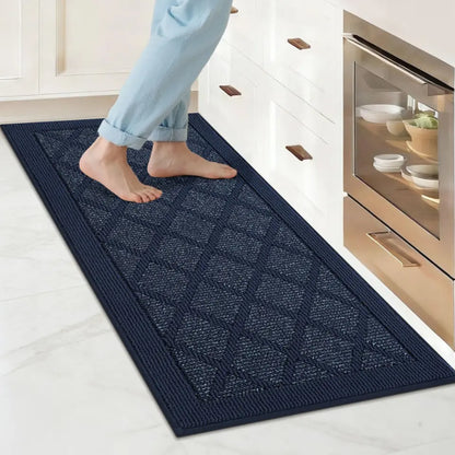 Person walking on a blue patterned rug in a kitchen.