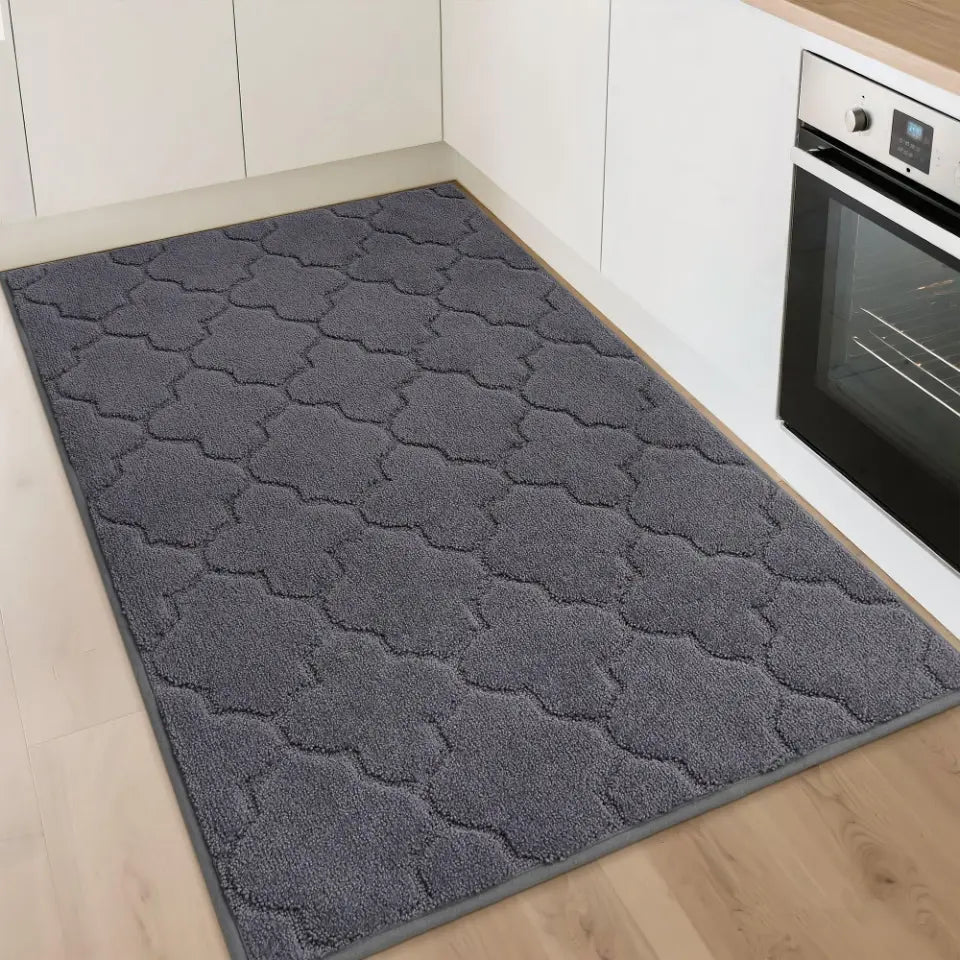 Dark Gray patterned rug on a wooden floor in a kitchen setting.